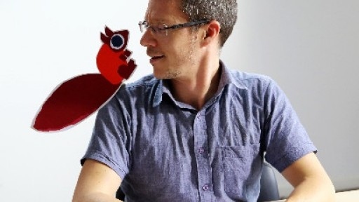 Image of children's author CHris Haughton with a cartoon squirrel on his shoulder