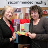MLF board member stands with poet laureate Carol Ann Duffy in a library