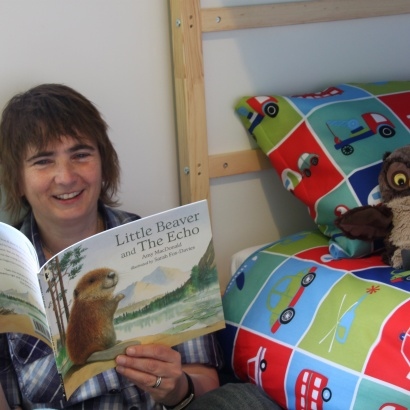 MLF Director Cathy Bolton reading a colurful picture book