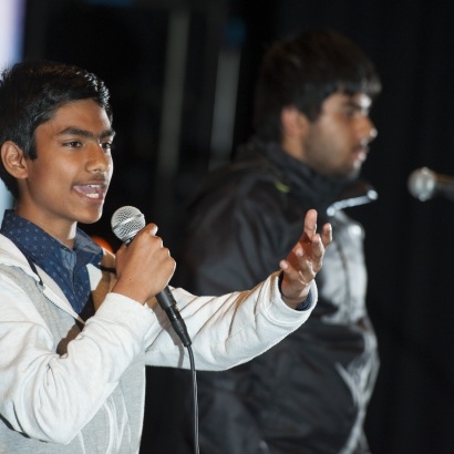 Image of two of the Wordsmith Showcase performers on stage