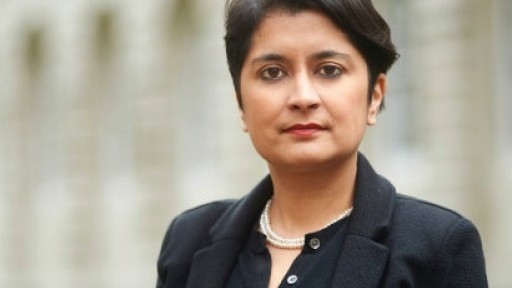 Photo of human rights activist and author Shami Chakrabarti with a building behind her