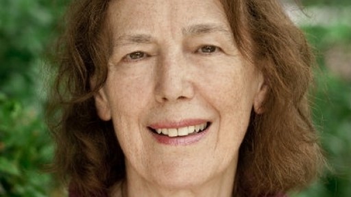 Picture of author Claire Tomalin in front of some trees.