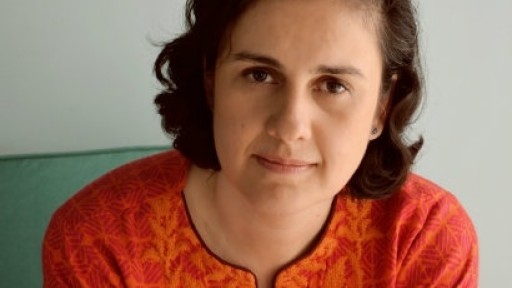 Image of Kamila Shamsie in an orange, patterned shalwar kameez