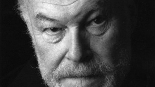 Close-up image of Timothy West's face, with an entirely black background