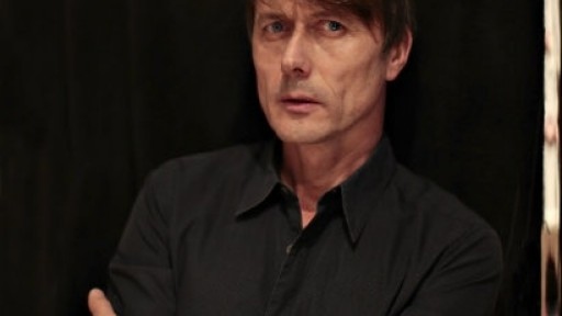 Image of Brett Anderson looking serious in a black shirt
