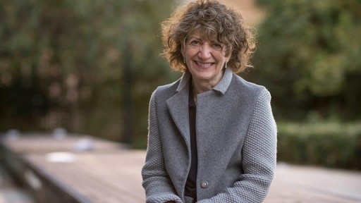 Author and psychotherapist Susie Orbach against a backdrop of trees