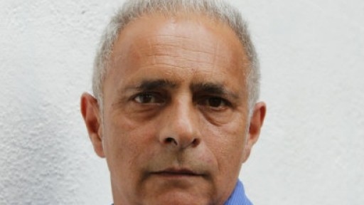 Headshot of author Hanif Kureishi