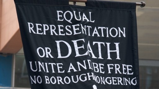 Photo of banner asking for Equal Representation or death