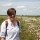 Clare Shaw stood in front of cotton grass