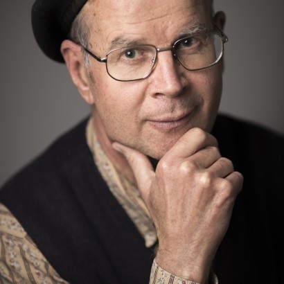 Australian author Peter Bakowski in black beret, glasses, shirt and waistcoat