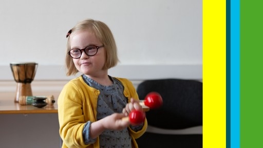 Photo of young girl with glasses holding a shaker
