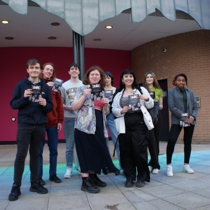 Group of young people stood outside Contact theatre