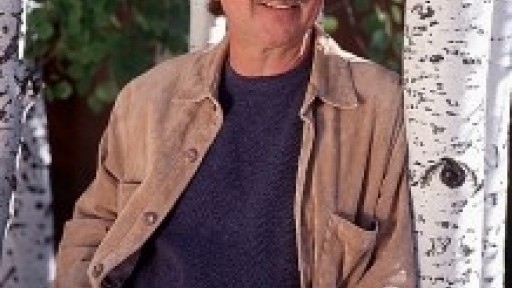 Mystery and action thriller writer David Morrell looking like a detective in sunglasses, blue jeans, sweater and jacket.