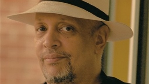 Prolific crime and thriller writer Walter Mosley looking suave in a blazer and panama hat.