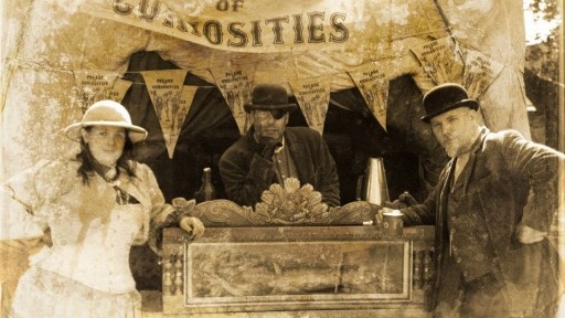 Sepia photo of performance troupe Palace of Curiousities