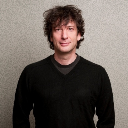 Cult author and graphic novelist Neil Gaiman in his trademark black knitwear.