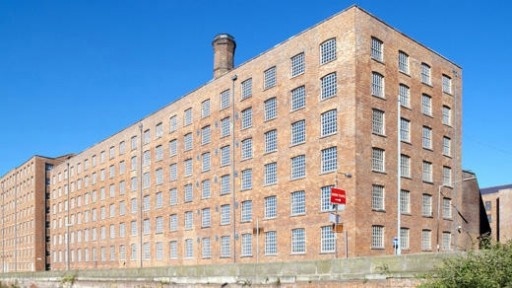 Photo of Murrays Mill, a large industrial brick mill in Ancoats and the setting for several literary books