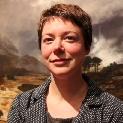headshot of Jen Hadfield infront of landscape painting